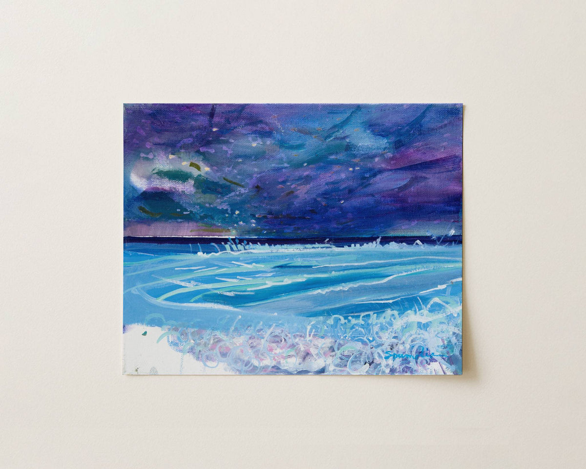 A square canvas painting of an ocean scene under a stormy purple and blue sky, mounted on a light beige wall.